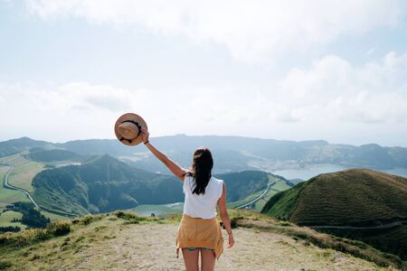 woman traveling with amazing mountains and forest, wanderlust travel concept, space for text,...