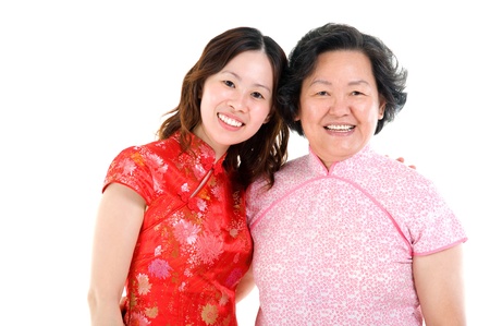 asian mother and daughter in traditional costume, cheongsam の写真素材