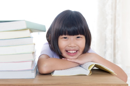 Little asian girl readingの写真素材