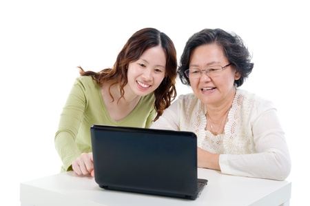 asian senior woman learns to use computer の写真素材