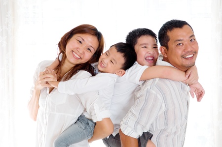 Indoor portrait of beautiful asian family