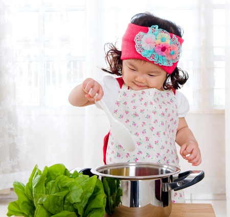 Little chef in actionの写真素材