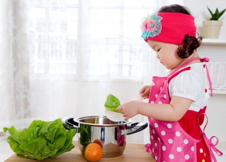 Little girl cookingの写真素材