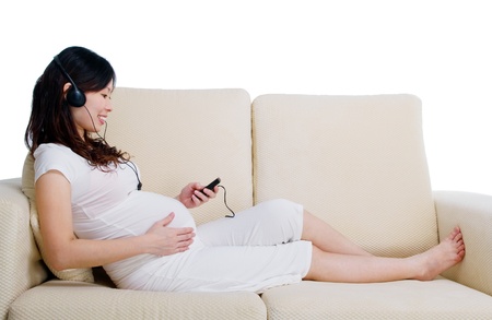 Pregnant woman listening to musicの写真素材