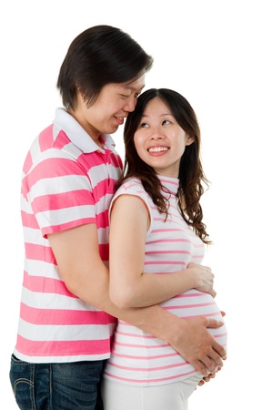 Asian pregnant woman looking at her husbandの写真素材