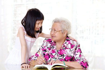Asian senior woman and her granddaughterの写真素材