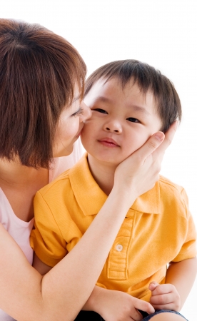 Asian woman kiss her sonの写真素材