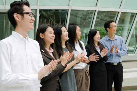 Asian business team clapping hands の写真素材