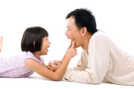 Asian father having fun with daughterの写真素材