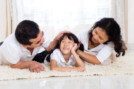 Mixed race family relax at homeの写真素材