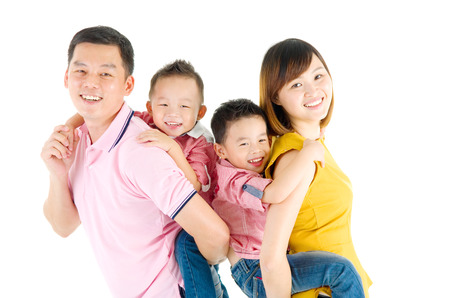 Studio portrait of beautiful asian familyの写真素材
