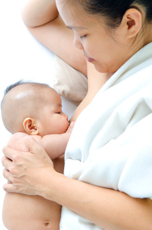 Asian woman breastfeeding her babyの写真素材
