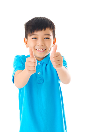 Asian boy raised his thumbs upの写真素材