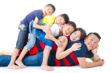 Asian family having piggyback funの写真素材