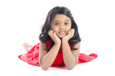 Lovely indian girl lying on the floorの写真素材