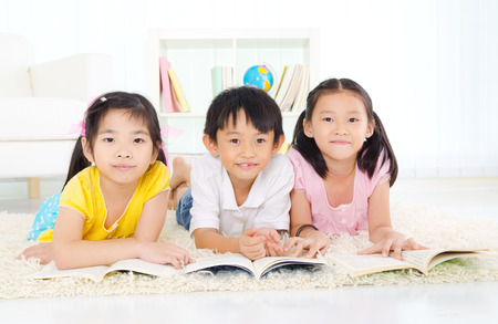 Asian kids readingの写真素材