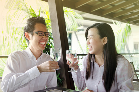 Asian business executives having discussion in the restaurantの写真素材