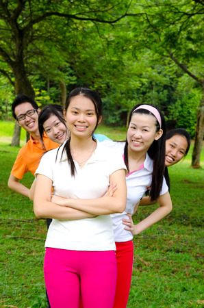 Young asian adults in sports outfitの写真素材