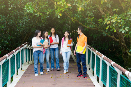 Group of asian college students walking in the parkの写真素材