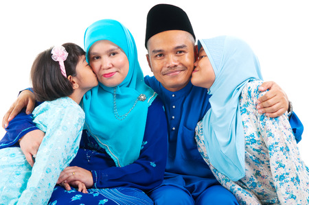 Malay girls kiss their parentの写真素材