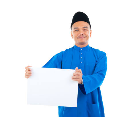 Muslim man holding a white boardの写真素材