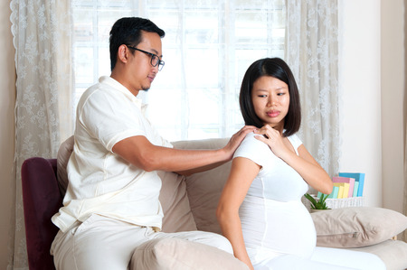 Asian man massage for her wife who suffer shoulder painの写真素材