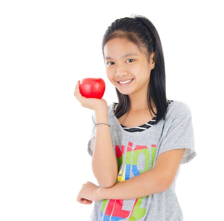 Asian girl holding an appleの写真素材
