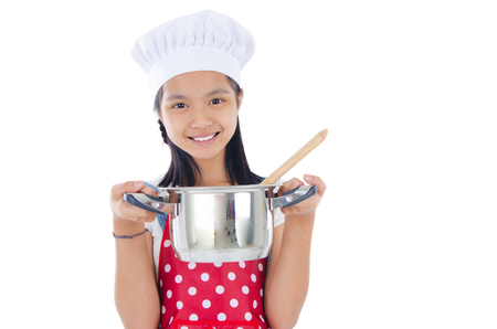 Asian girl wearing apron and holding a cooking potの写真素材