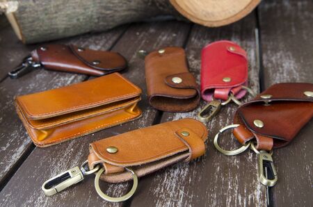 Leather key holder on wooden backgroundの写真素材