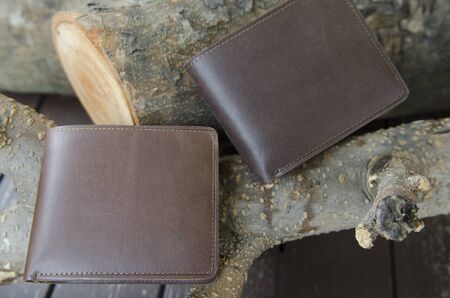 men's wallet on rough wood backgroundの写真素材