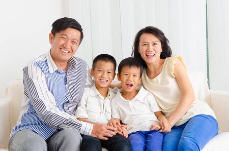 Indoor portrait of asian familyの写真素材
