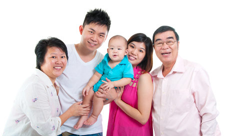 Portrait of asian three generations family isolated on white backgroundの写真素材