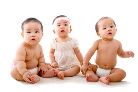 Lovely asian babies sitting on the floorの写真素材