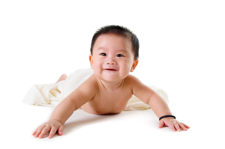 Asian baby boy crawl on the floorの写真素材