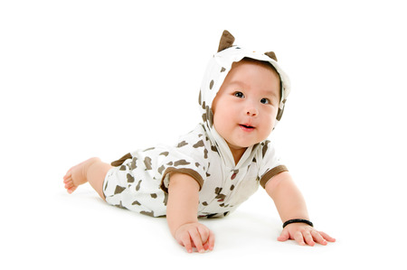 Indoor portrait of lovely asian baby on white backgroundの写真素材