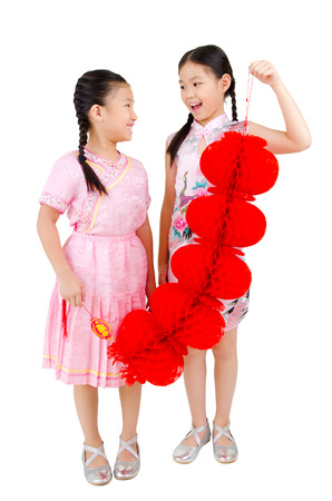 Asian girl in traditional chinese costume, cheongsam holding lantern decoration. Chinese new year concept.の写真素材