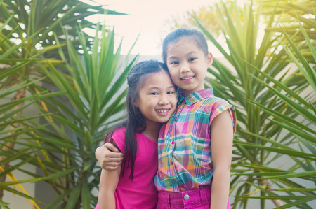 Outdoor portrait of lovely asian girlsの写真素材