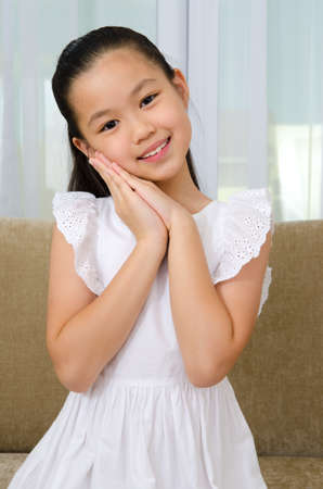 Indoor portrait of a lovely asian girlの写真素材