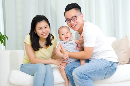 Indoor portrait of asian familyの写真素材