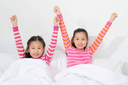 Asian kids wake up in the morningの写真素材