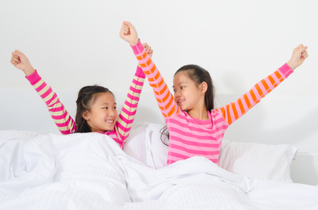 Asian children wake up in the morningの写真素材