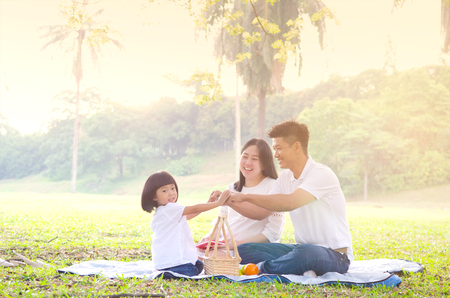 Asian family enjoying outdoor natureの写真素材
