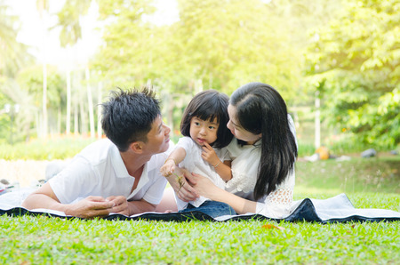 Asian family enjoying outdoor nature in the parkの写真素材