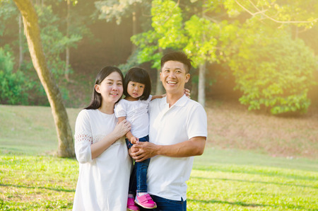 Asian family enjoying outdoor nature in the parkの写真素材