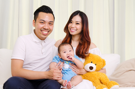 Indooor portrait of beautiful asian familyの写真素材