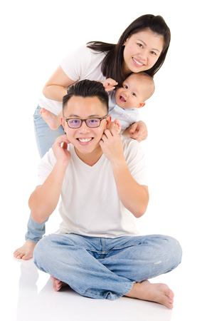 Indoor portrait of beautiful asian familyの写真素材