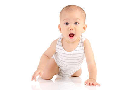 Asian crawling baby with funny expressionの写真素材