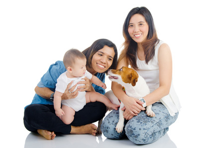 Asian family and their pet dogの写真素材