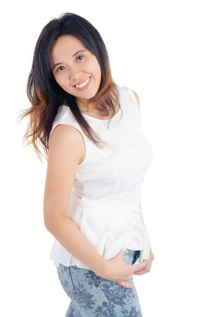 Indoor portrait of a cheerful asian womanの写真素材