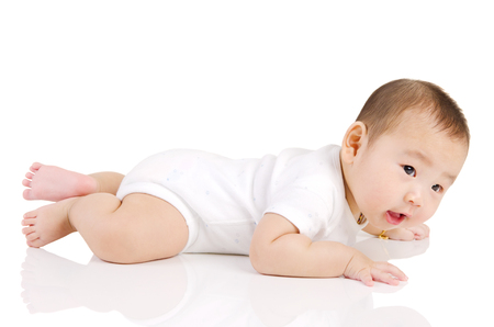Lovely asian baby crawl on the floorの写真素材